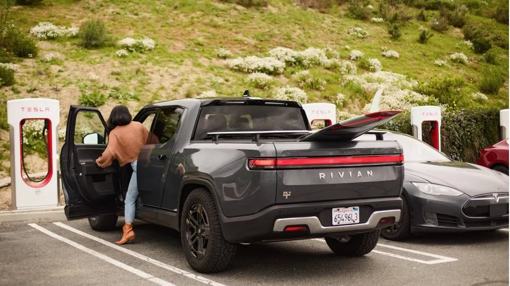 Rivian R1T at Tesla Supercharger