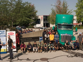 Students in front of electric Peterbilt