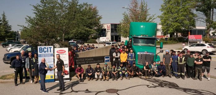 Students in front of electric Peterbilt